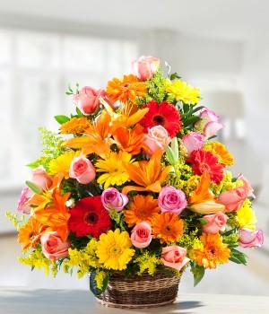  Premium Arrangement of Exotic 60+ Flowers like Lilies, Daisies & LS Roses.
 Arranged in wooden Basket.
 Free Message Card
