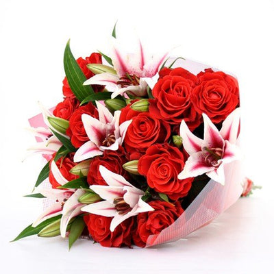  Pink Lilies and Red Roses Love bouquet wrapped in cellophane paper (20+ Flowers).
 Free Message Card