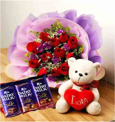  12 Stem Red Roses wrapped in special crape paper
 3 Cadbury silk chocolates :60 gm each
 Cute Teddy bear (6 inch)
