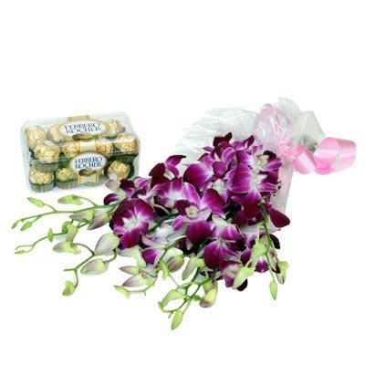  Bouquet of 10 Stem Purple orchids wrapped in cellophane paper 
16 pcs Ferrero rocher" Chocolate box (200 gm) 
 Free Message Card