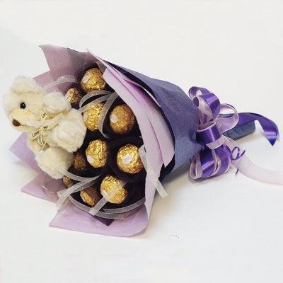 Ferrero Rocher 16 peaces bouquet arranged in a crape paper packing 
 Cute Teddy Bear (6 inch).
 Free Message Card