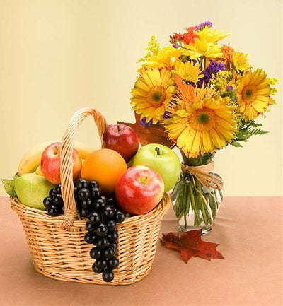 6 KG Fresh Fruits Basket (Seasonal Fruits) 
15 Mixed Flowers Bouquet (Add VASE from the add on products)
Free Message card.