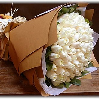 •	40 White Roses Bunch with Special Paper packing
 Free Message Card