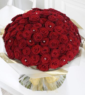  90 Stem Pure Red Roses wrapped in cellophane sheet.
 Free Message Card