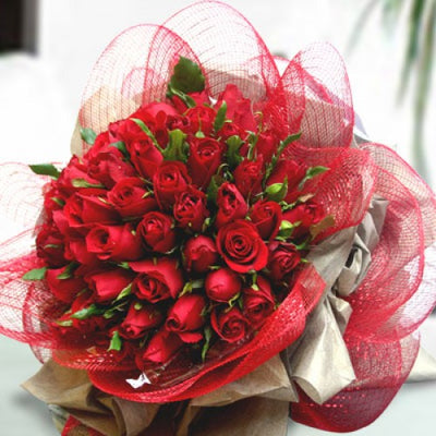  50 fresh red roses.
 Free Message Card