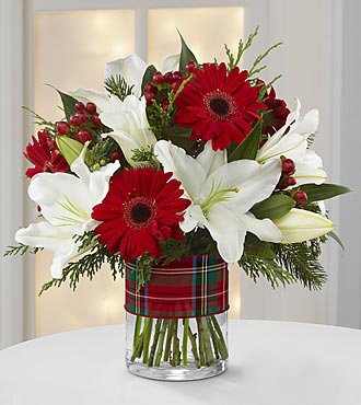  Exotic White Lily & Red Daisies Bouquet (10-12 Flowers).
 Free Message Card.

NOTE: Vase not included in any product unless added separately.