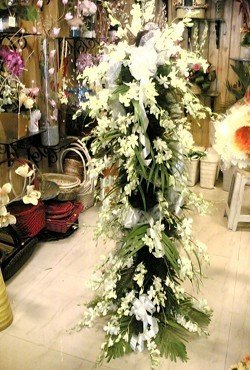  Exotic white soniya orchids with lush green fillers and decor.
 Flowers: 80+ (Incl White Orchids & Oriental Lilies).

&#8226 Free Message card