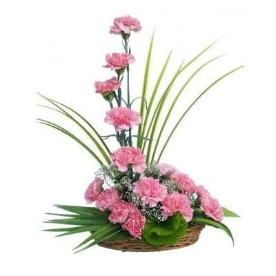 Basket arrangement of 18 pink carnations.