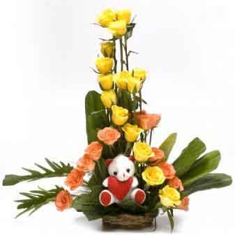 30 Bright Roses and a small teddy situated in basket.