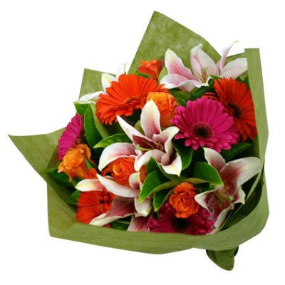  Bountiful Premium Bouquet of mixed exotic flowers, Incl Lilies, Gerbera and Roses
 Arranged in special crape paper packing
 Free Message Card