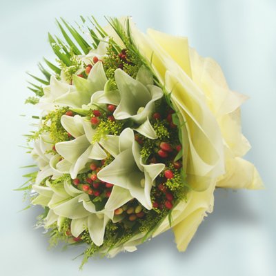 Exotic White Oriental Lilies bouquet wrapped 
 Special Crape paper packing with lush green fillers with it
 Free Message Card