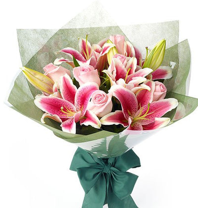  Pretty Pink Roses and Exotic Pink Lilies gorgeous bouquet with special Pink wrap on it
 Free Message Card