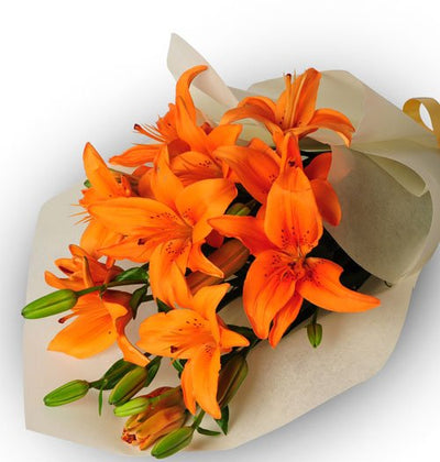  5 stem exotic orange Lilies Bouquet wrapped in cellophane paper
 Free Message Card