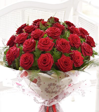  Premium 25 Red Roses Bouquet wrapped in cellophane packing
 Free Message Card