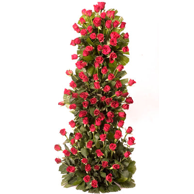  100 stalk of premium Red Roses arranged with the help of stand with lush green fillers in it.
 Height: Aprox 3-4 Feet.
&#8226 Free Message Card
