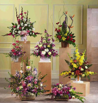  7 Different arrangement of Exotic Mixed Flowers arranged with Glass VASE and Cane Baskets.
 Free Message Card.