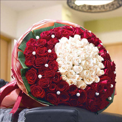 •	100 pearl-pinned red and white roses arrangement.
